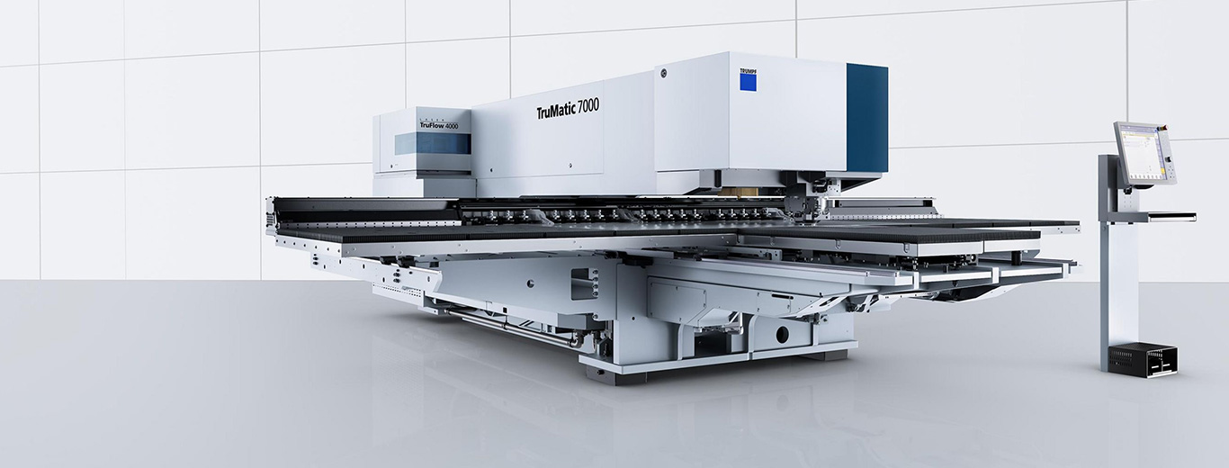 Punch-laser combination with cutting table and clamp strip
